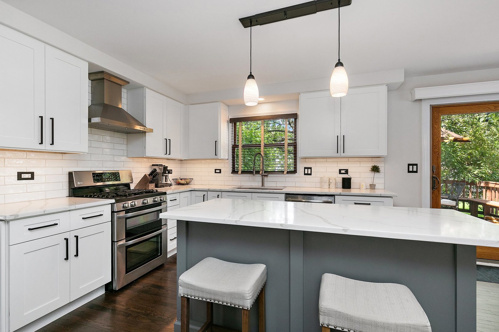 1010 Wakefield Drive Elgin, IL 60120 - Photo 4 of 32 a kitchen with stainless steel appliances a sink a stove a window cabinets and a dining table
