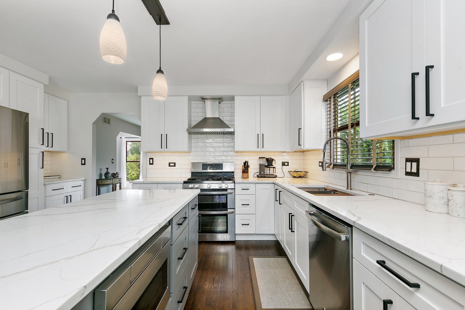 1010 Wakefield Drive Elgin, IL 60120 - Photo 5 of 32 a kitchen with a sink a stove and cabinets