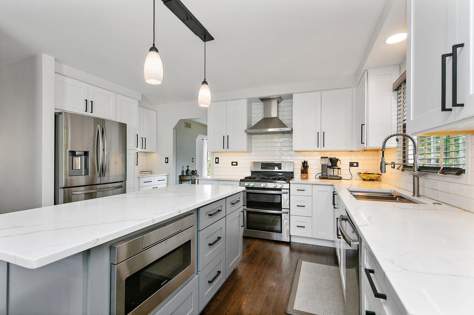 1010 Wakefield Drive Elgin, IL 60120 - Photo 6 of 32 a kitchen with stainless steel appliances a sink stove and refrigerator