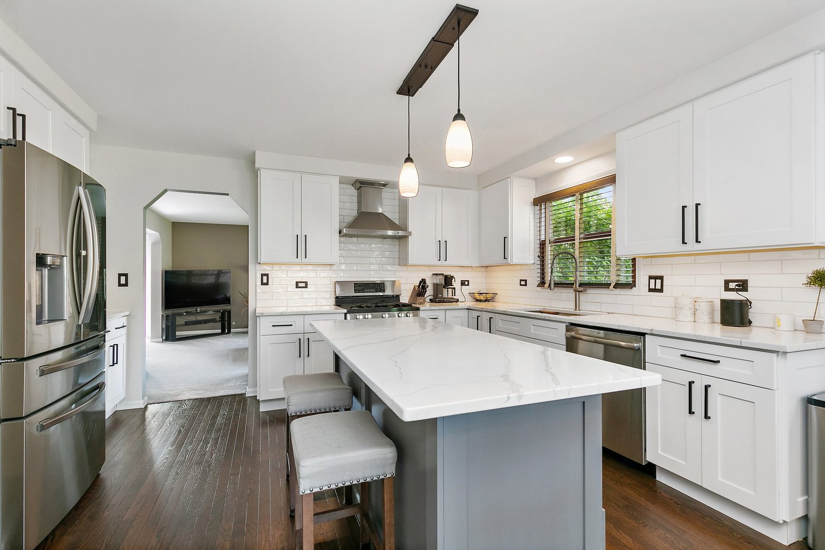 1010 Wakefield Drive Elgin, IL 60120 - Photo 7 of 32 a kitchen with a sink stainless steel appliances and cabinets