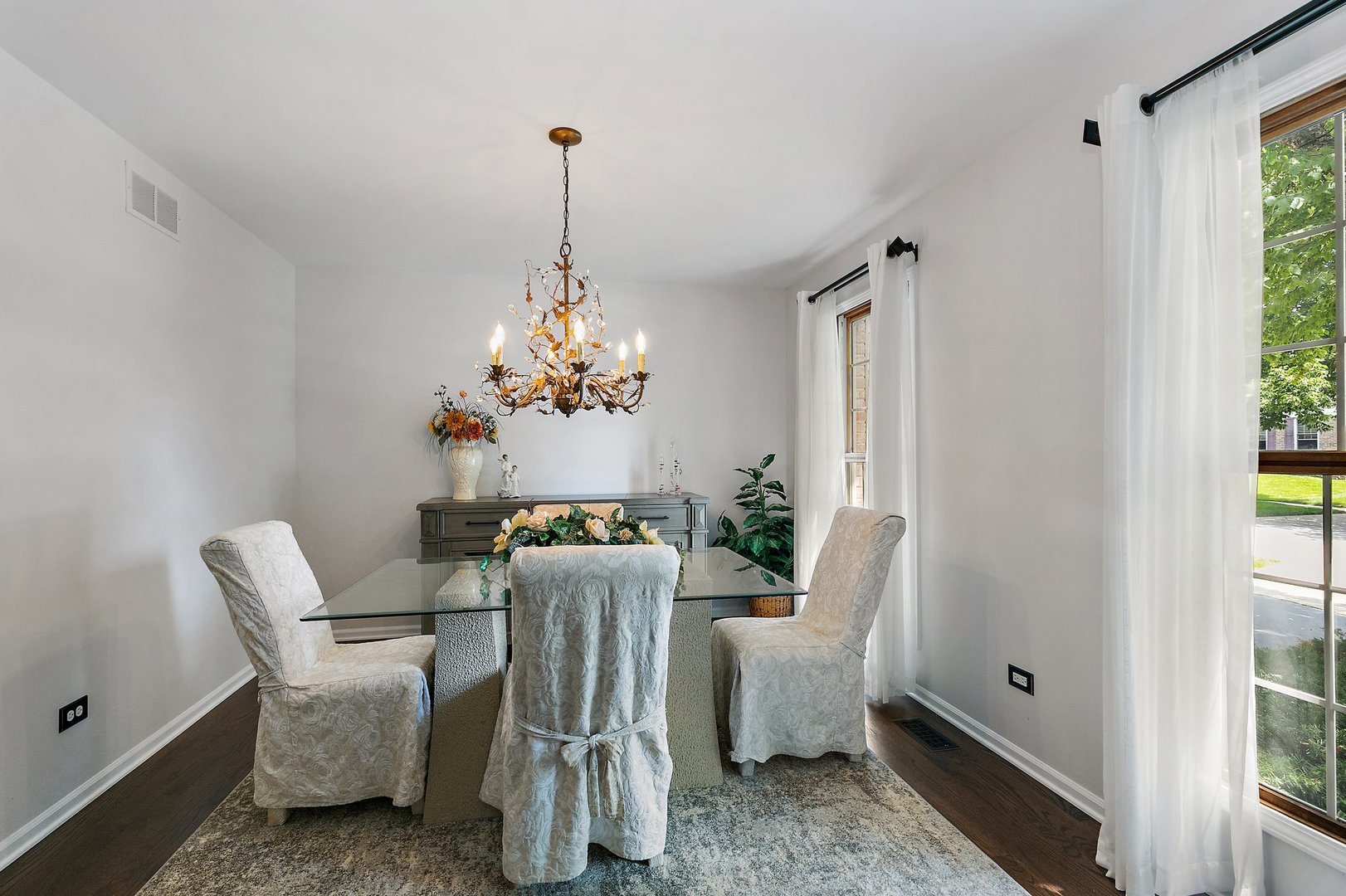 1010 Wakefield Drive Elgin, IL 60120 - Photo 10 of 32 a dining room with furniture a chandelier and wooden floor