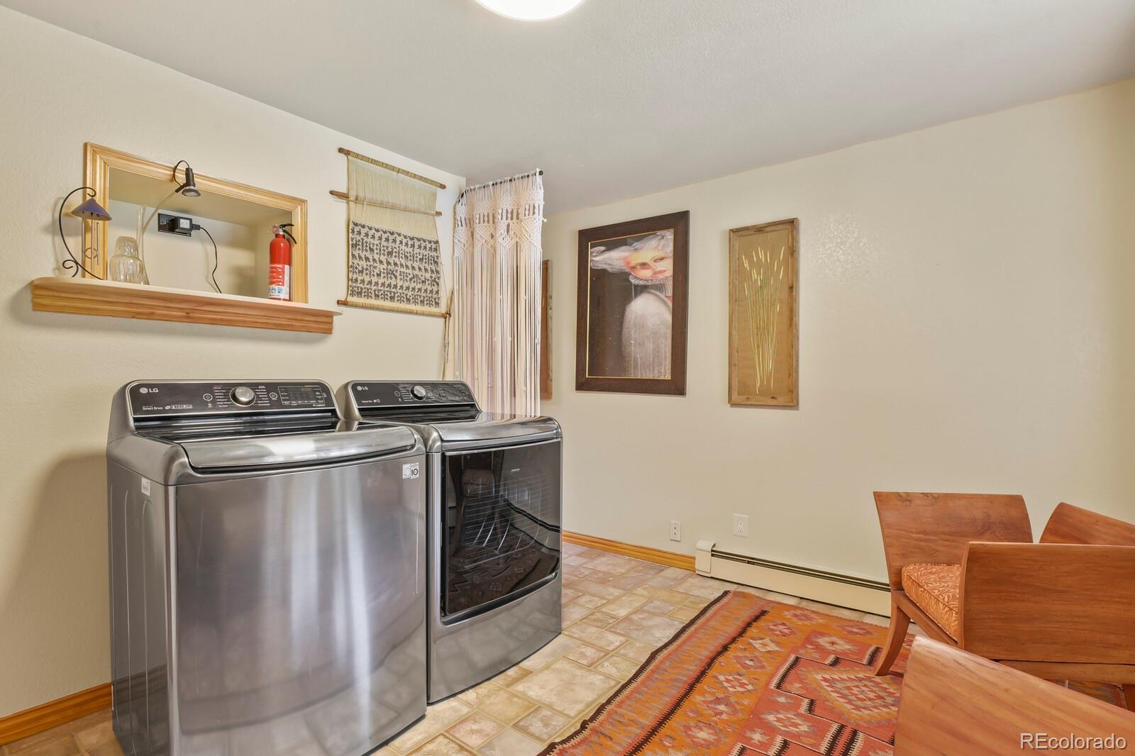 417 Witter Gulch Road Evergreen, CO 80439 - Photo 42 of 50 a kitchen with stainless steel appliances granite countertop a stove and a refrigerator