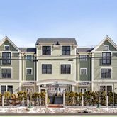 a view of a big house with large windows
