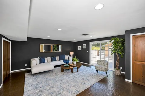 a living room with furniture and a rug