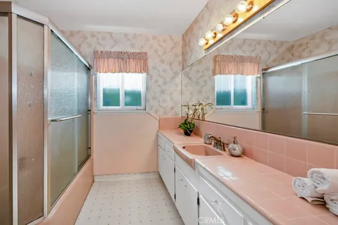 a view of a livingroom with wooden floor and window