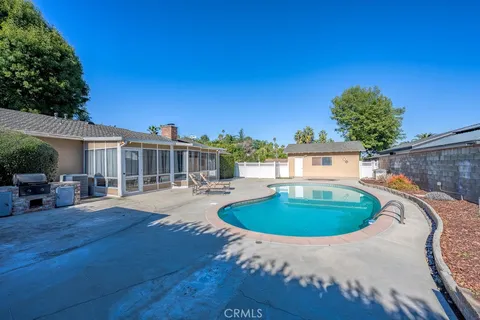 a backyard with table and chairs