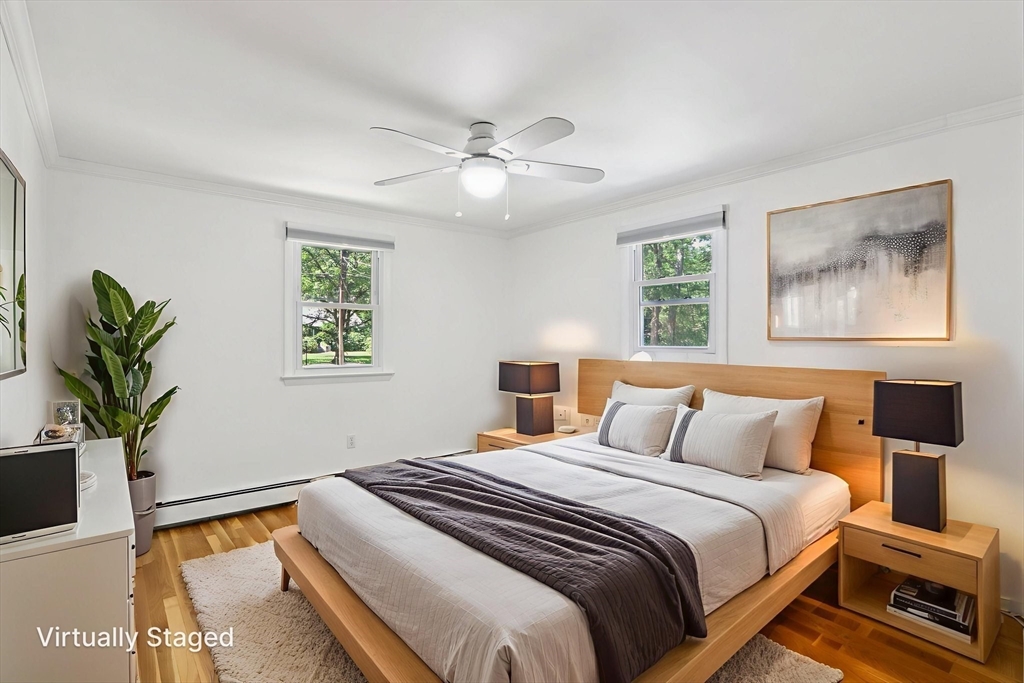 196 Hudson Road Stow, MA 01775 - Photo 17 of 31 a bedroom with a bed and a painting on the wall