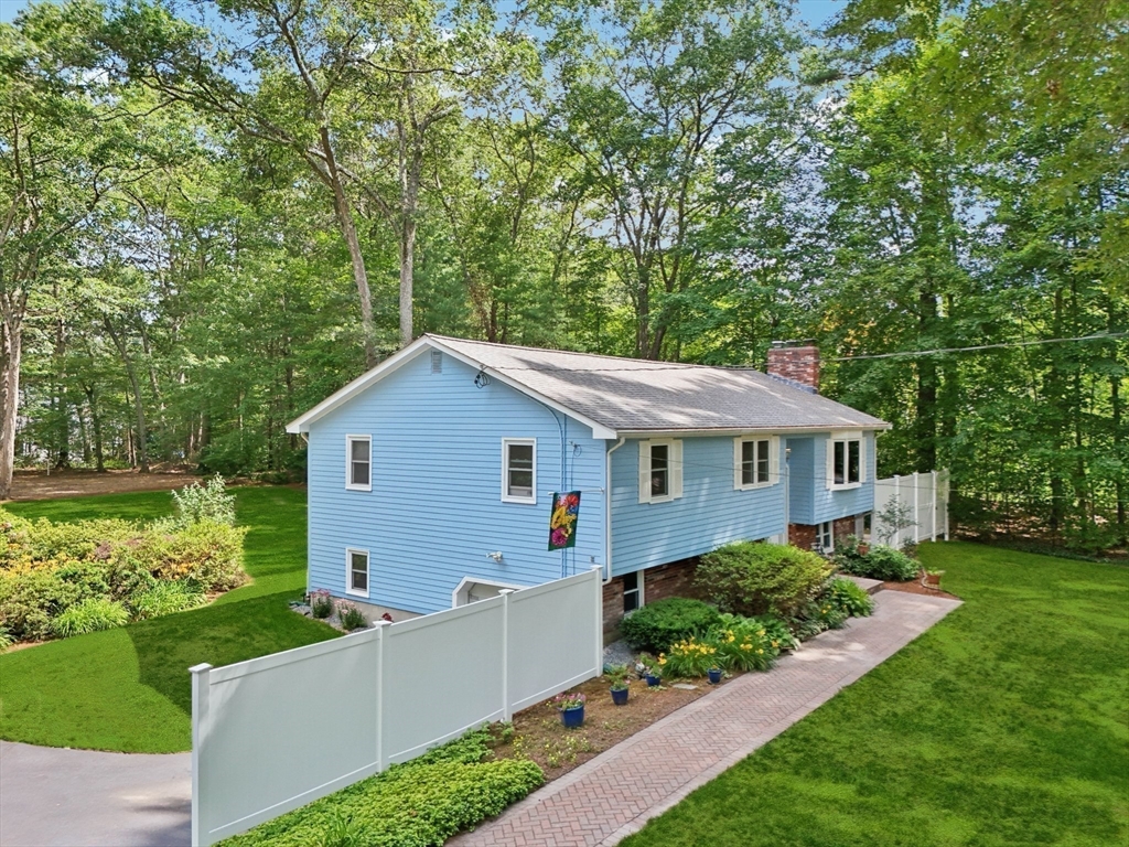 196 Hudson Road Stow, MA 01775 - Photo 30 of 31 a front view of a house with a yard