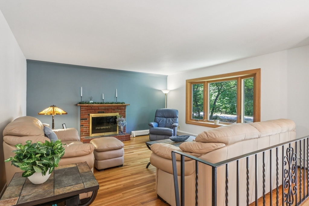 196 Hudson Road Stow, MA 01775 - Photo 4 of 31 a living room with furniture and a fireplace