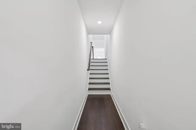 a view of a hallway with stairs