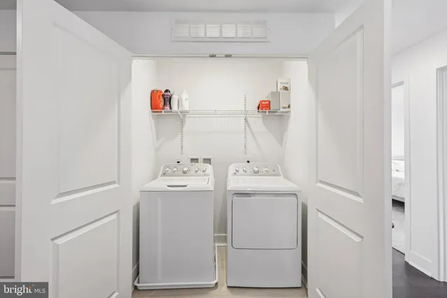 a utility room with dryer and washer