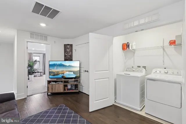 a bed room with a bed and a chair