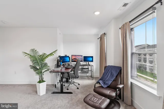 a bedroom with furniture and a window
