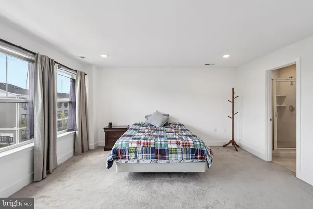 a bathroom with a shower and a glass door