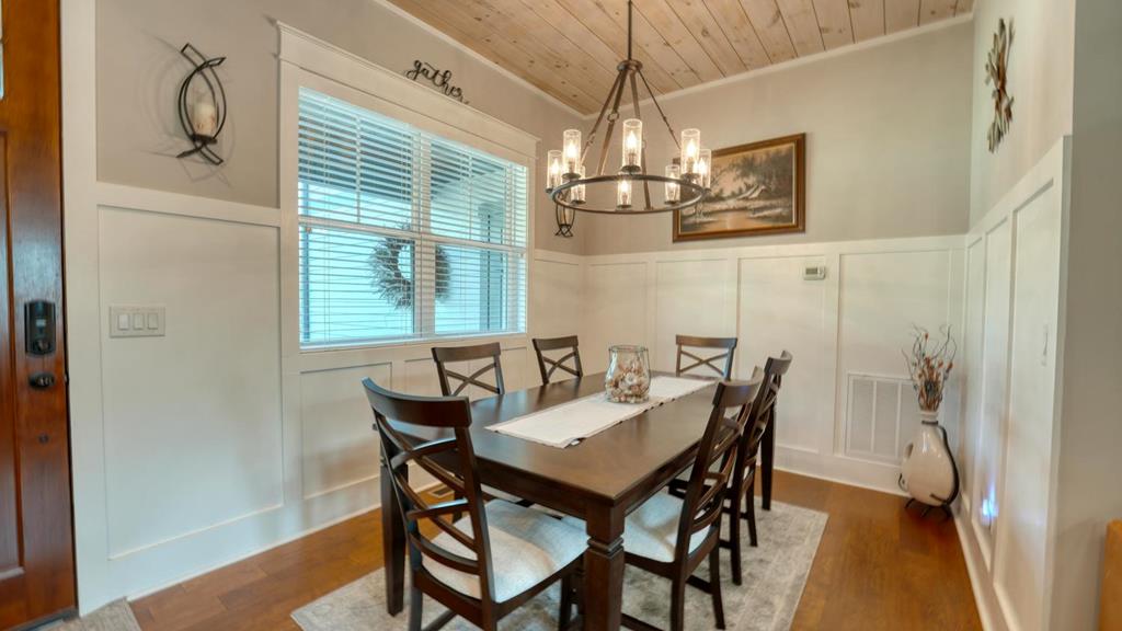 31 Elf School Road Hayesville, NC 28904 - Photo 32 of 59 a view of a dining room with furniture window and wooden floor