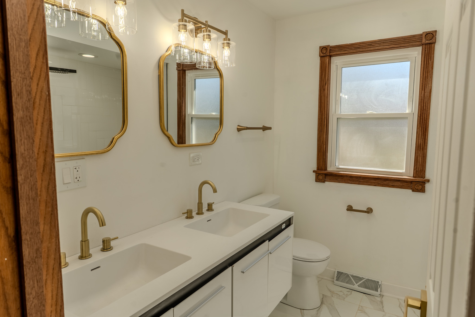 888 Woodstock Road Olympia Fields, IL 60461 - Photo 18 of 30 a bathroom with a toilet sink and mirror