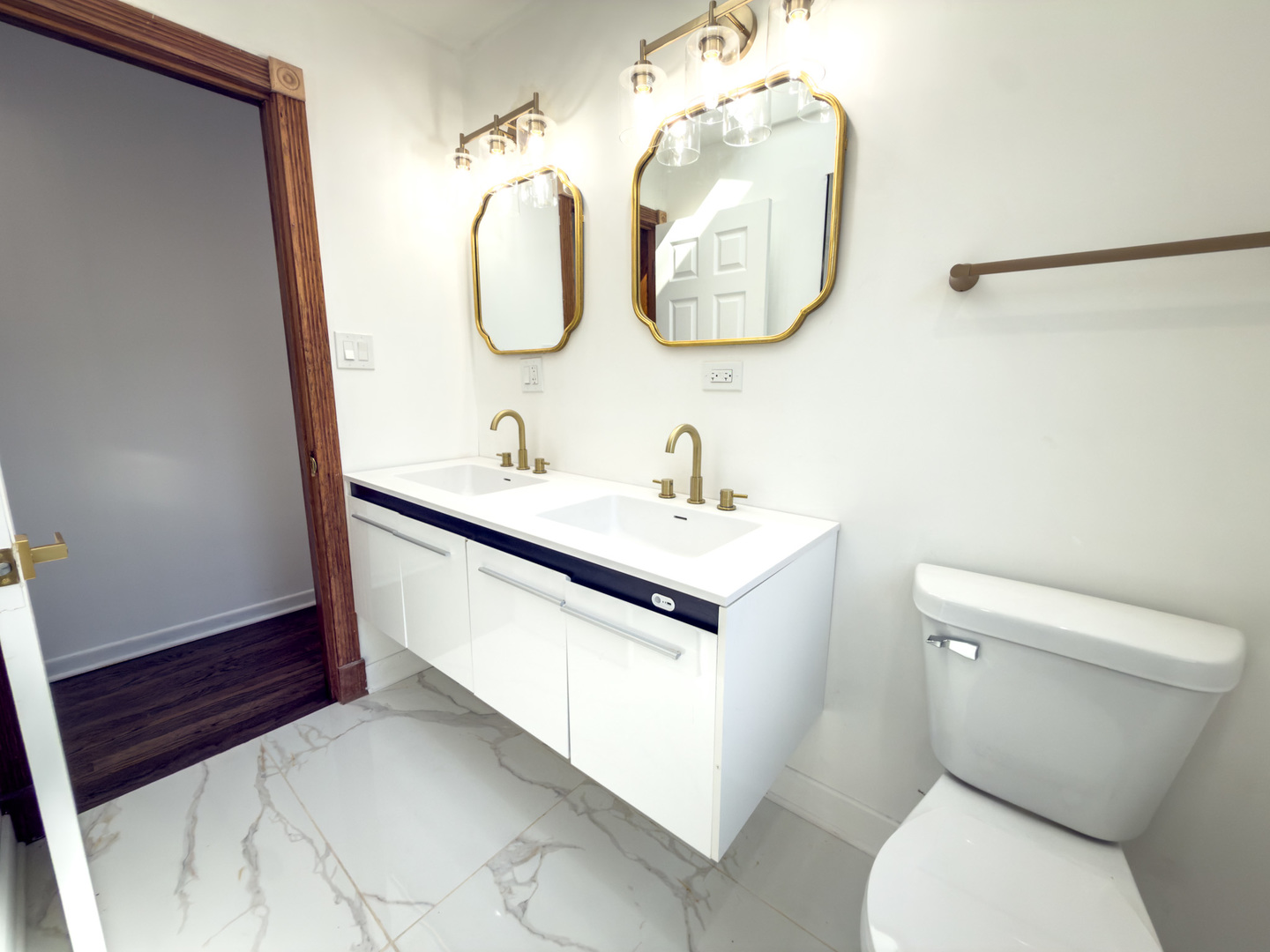 888 Woodstock Road Olympia Fields, IL 60461 - Photo 21 of 30 a bathroom with a toilet sink and mirror