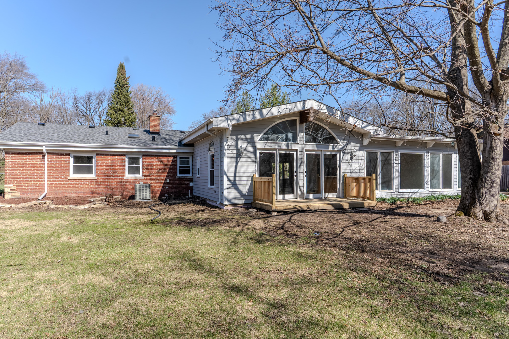 888 Woodstock Road Olympia Fields, IL 60461 - Photo 27 of 30 a patio with a table and chairs under an umbrella