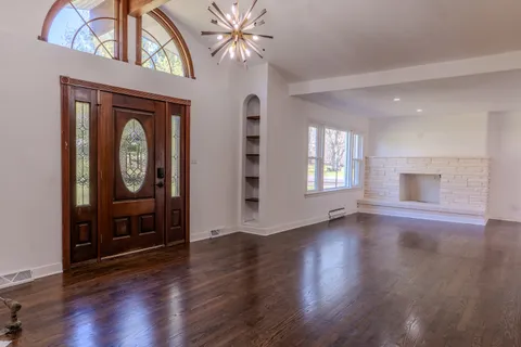 a view of an entryway with wooden floor