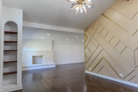 an entryway in a hall with a window