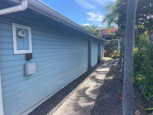 a pathway of a house with sitting area