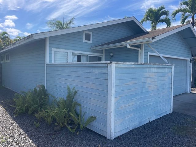 a brick house with a small yard