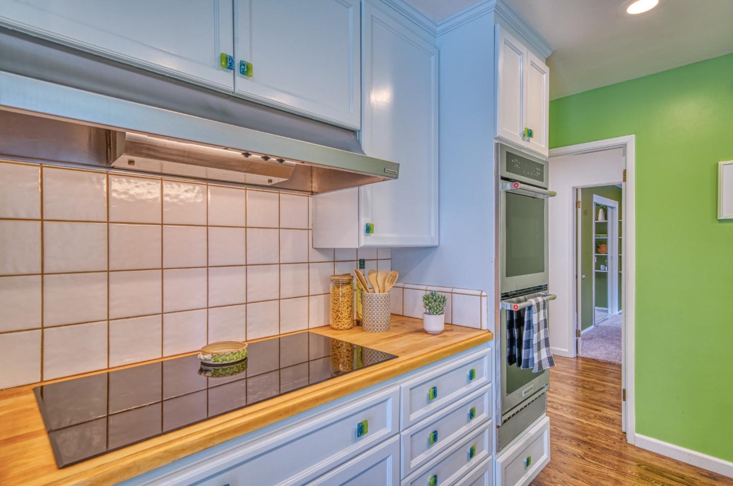 504 Cuesta Drive Aptos, CA 95003 - Photo 22 of 76 a kitchen with stainless steel appliances granite countertop a sink and cabinets