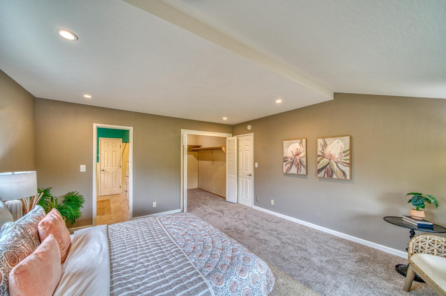 504 Cuesta Drive Aptos, CA 95003 - Photo 29 of 76 a spacious bedroom with a bed and wooden floor