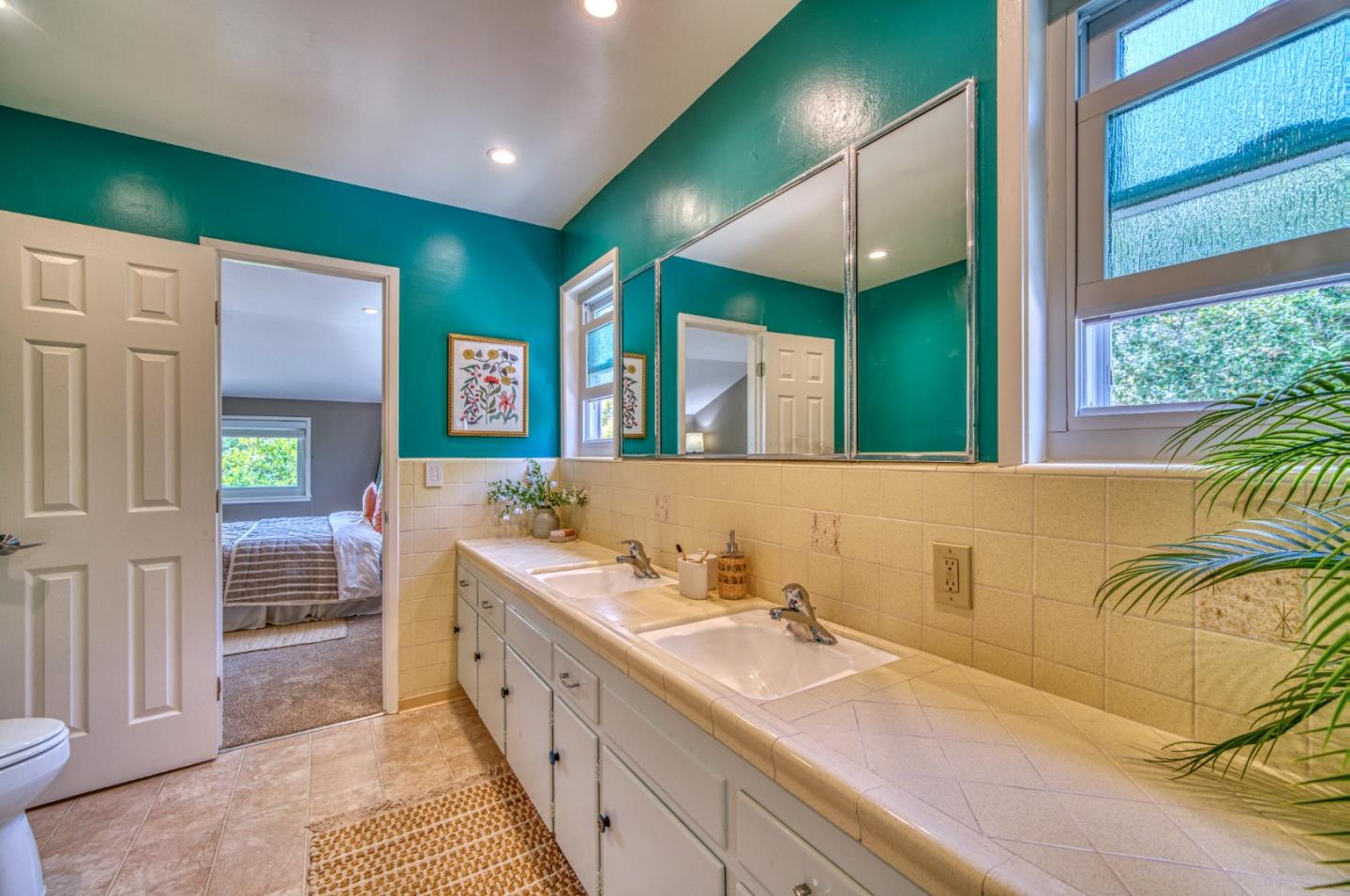 504 Cuesta Drive Aptos, CA 95003 - Photo 30 of 76 a bathroom with a double vanity sink and a mirror