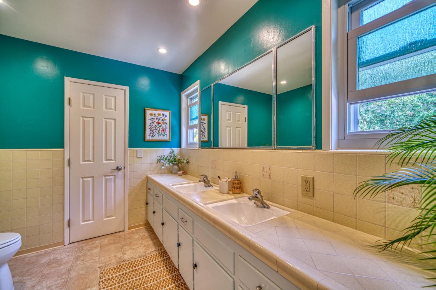 504 Cuesta Drive Aptos, CA 95003 - Photo 31 of 76 a spacious bathroom with a double vanity sink a mirror and a shower