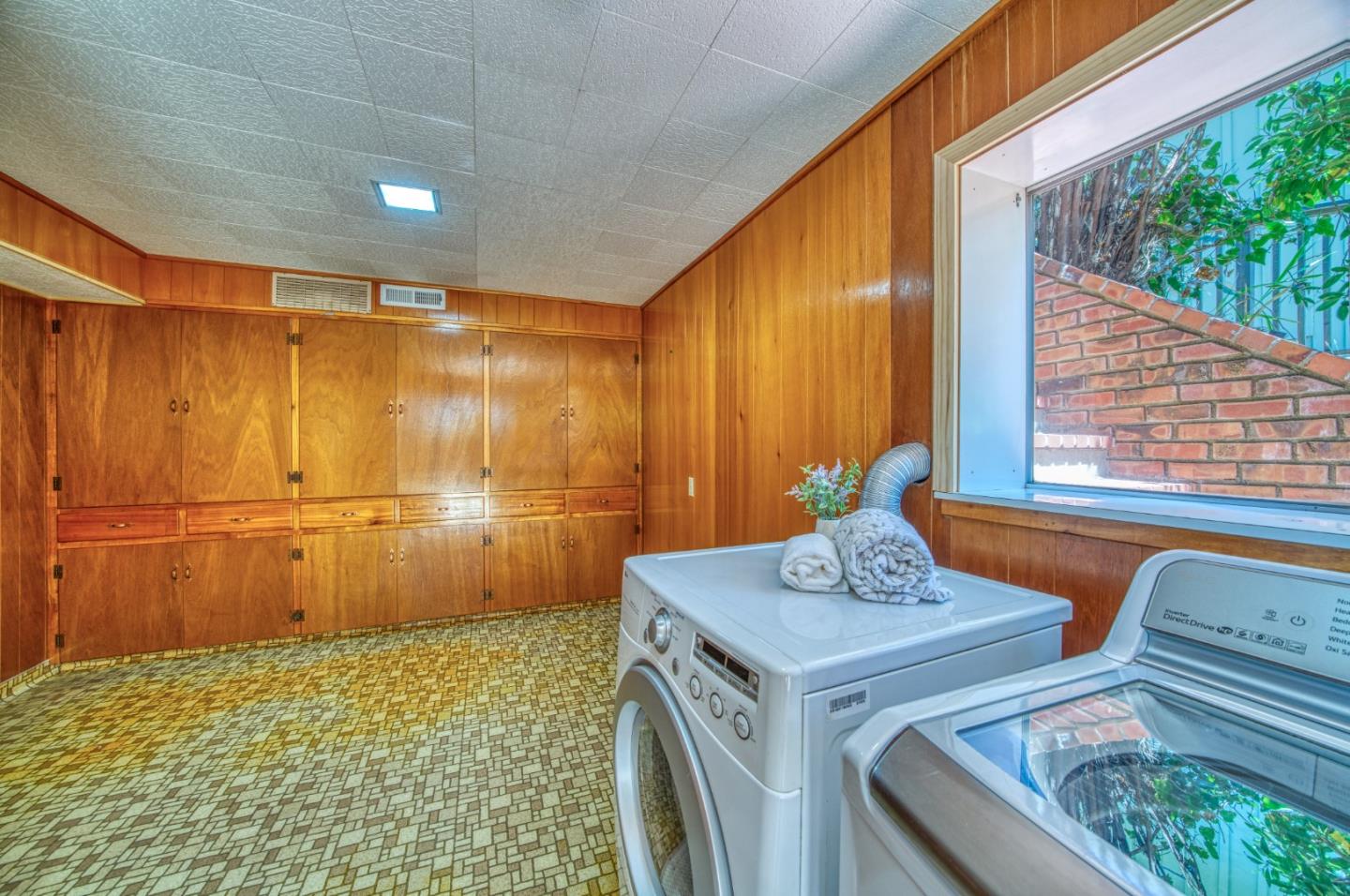 504 Cuesta Drive Aptos, CA 95003 - Photo 42 of 76 a bathroom with a sink and a mirror
