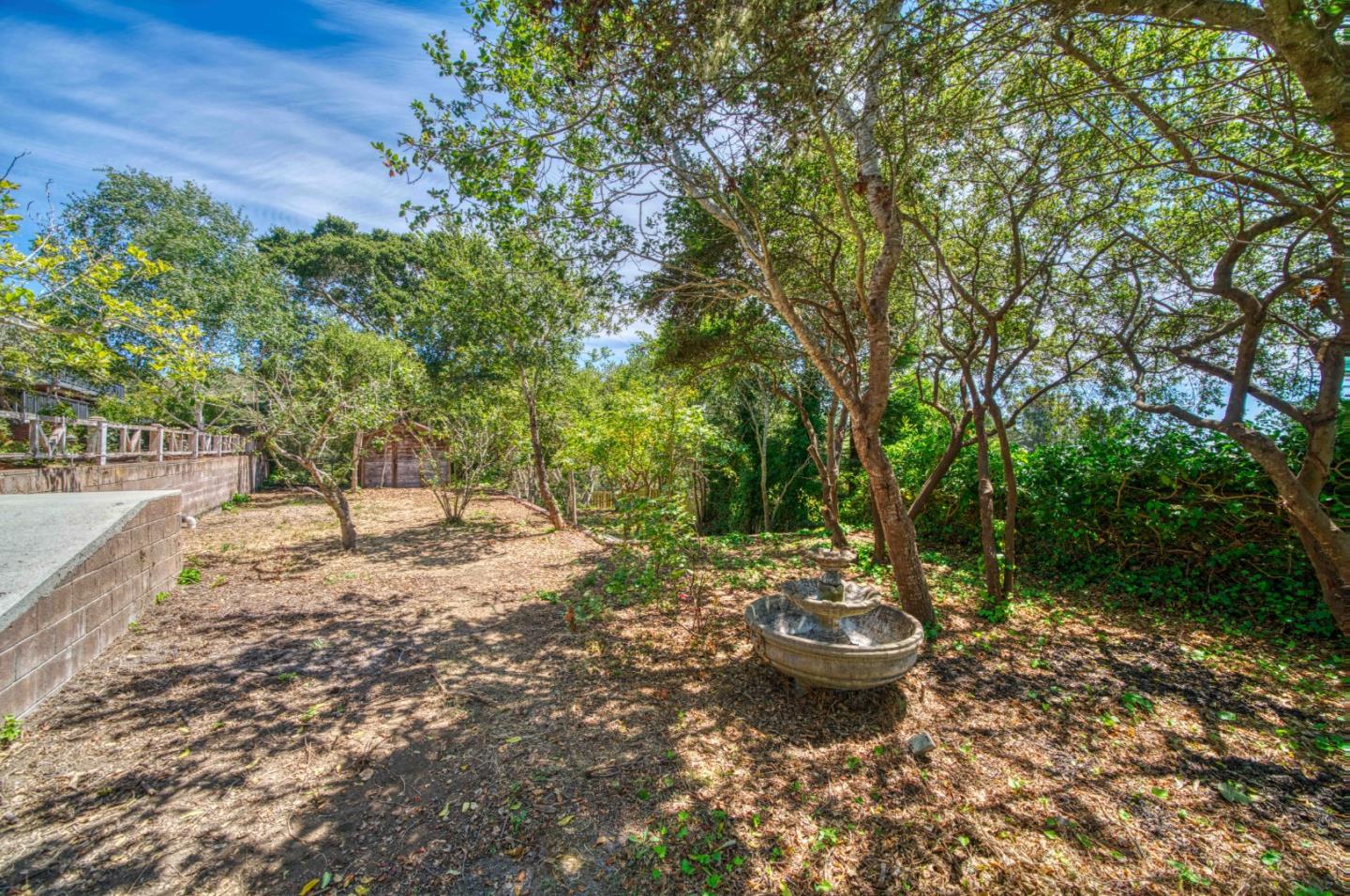 504 Cuesta Drive Aptos, CA 95003 - Photo 59 of 76 a view of a backyard with table and chairs and potted plants