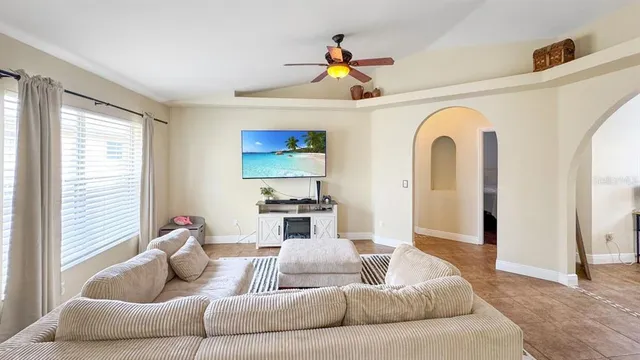 a living room with furniture and a large window