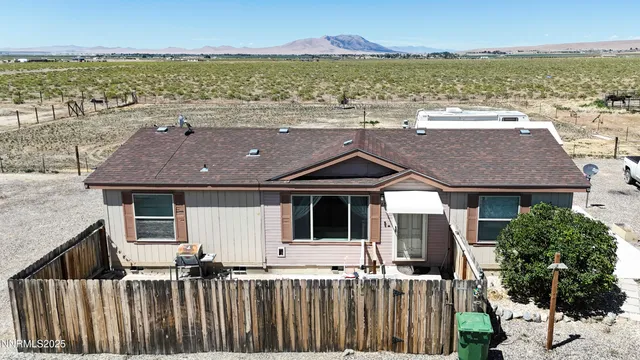 an aerial view of house with ocean view