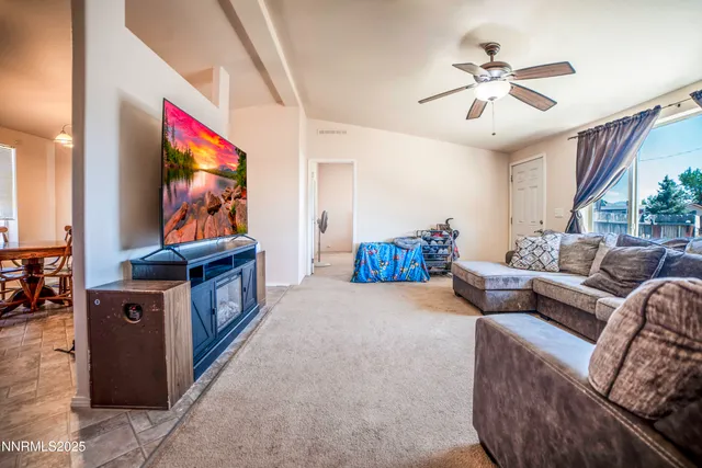 a bedroom with a bed and a book shelf