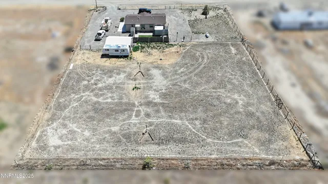 a kitchen with stainless steel appliances granite countertop a refrigerator a stove a sink and a dining table with granite countertops