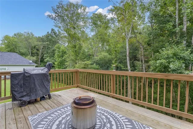 a view of a chair and table on the deck