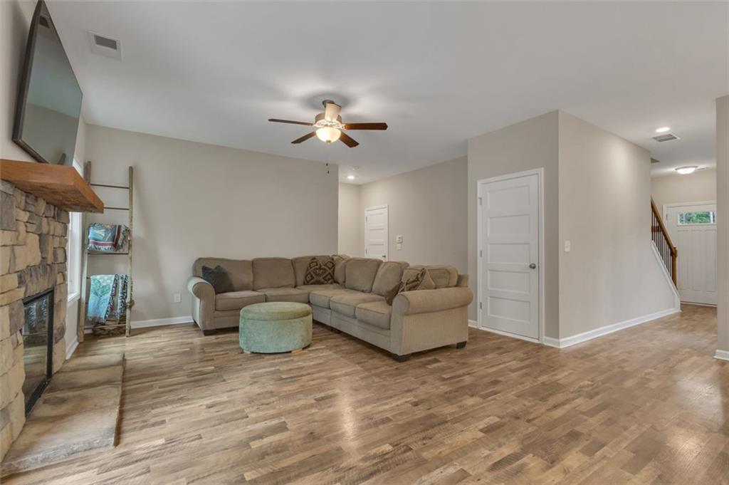 313 Lucy Lane Carrollton, GA 30117 - Photo 16 of 46 a living room with furniture and a flat screen tv
