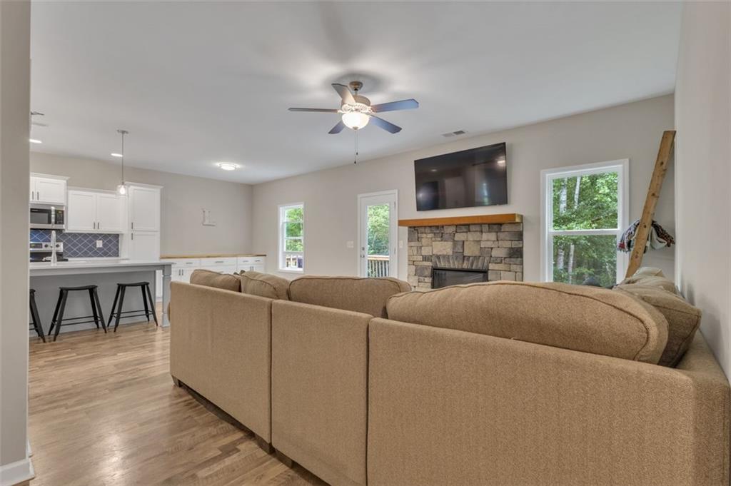 313 Lucy Lane Carrollton, GA 30117 - Photo 19 of 46 a living room with furniture and a fireplace