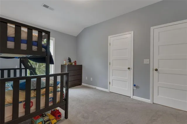 a view of an empty room with windows