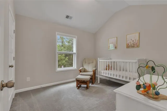 a bedroom with furniture and window