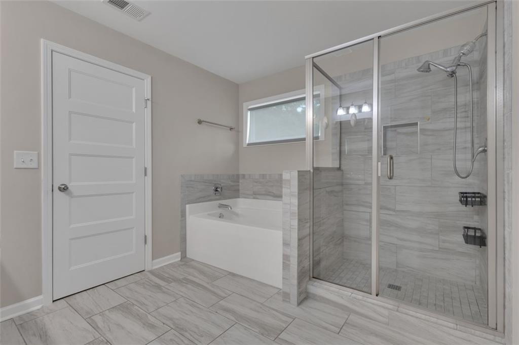 313 Lucy Lane Carrollton, GA 30117 - Photo 38 of 46 a bathroom with a shower and a sink