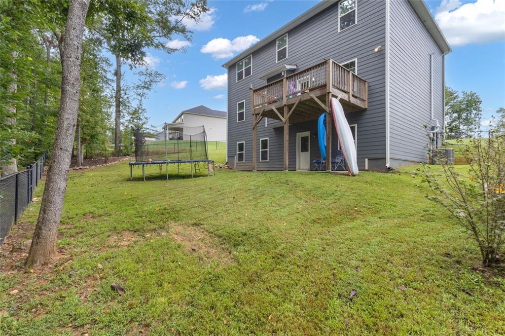 313 Lucy Lane Carrollton, GA 30117 - Photo 40 of 46 a view of a house with a yard and sitting area