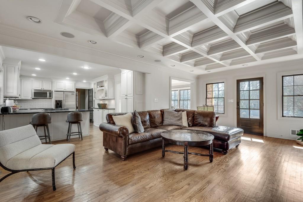 1846 Angelique Drive Decatur, GA 30033 - Photo 12 of 45 a living room with furniture kitchen view and a wooden floor