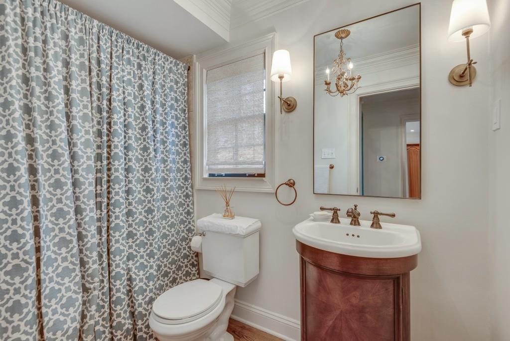 1846 Angelique Drive Decatur, GA 30033 - Photo 20 of 45 a bathroom with a sink a toilet and shower curtain