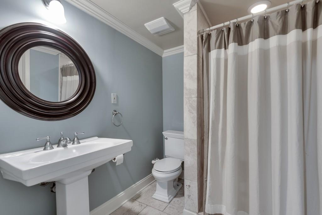 1846 Angelique Drive Decatur, GA 30033 - Photo 33 of 45 a bathroom with a toilet a sink and a mirror