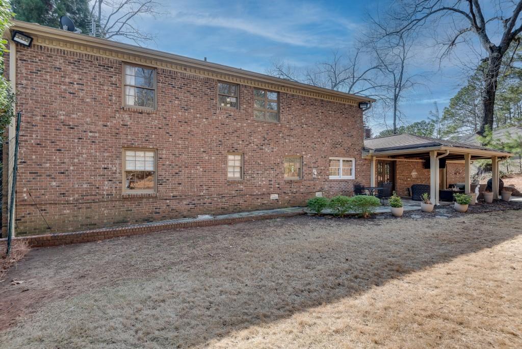 1846 Angelique Drive Decatur, GA 30033 - Photo 39 of 45 a view of a brick house with many windows next to a road
