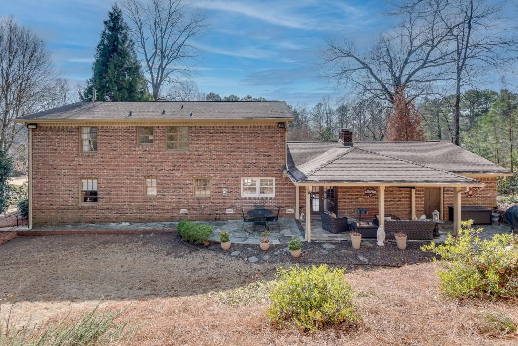 1846 Angelique Drive Decatur, GA 30033 - Photo 40 of 45 a backyard of a house with table and chairs