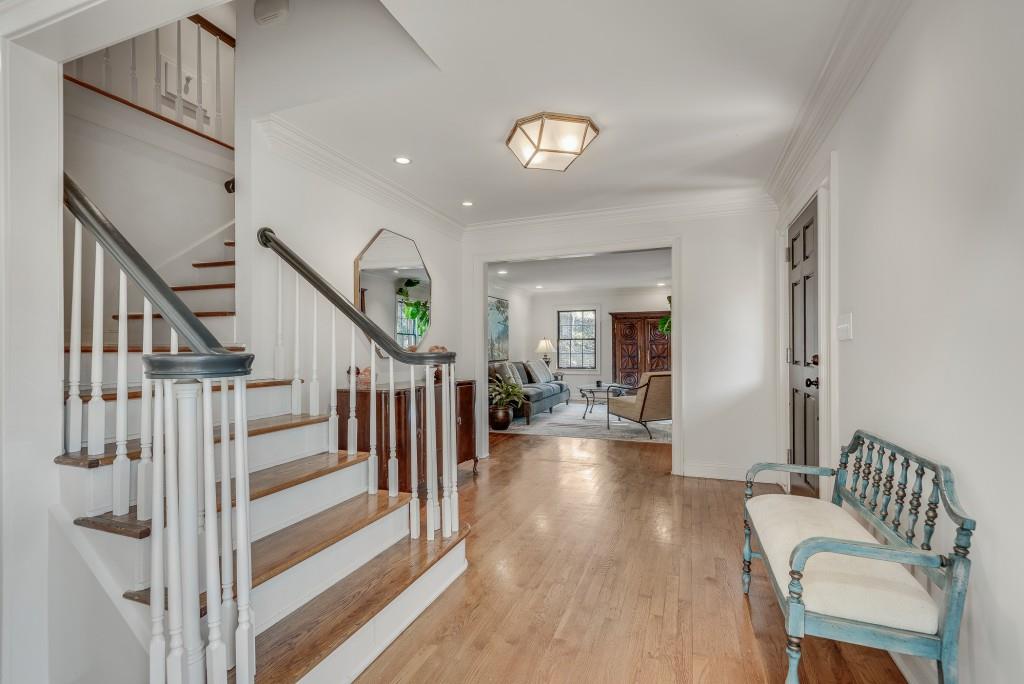1846 Angelique Drive Decatur, GA 30033 - Photo 4 of 45 a view of a hallway with couches and a dining table with wooden floor