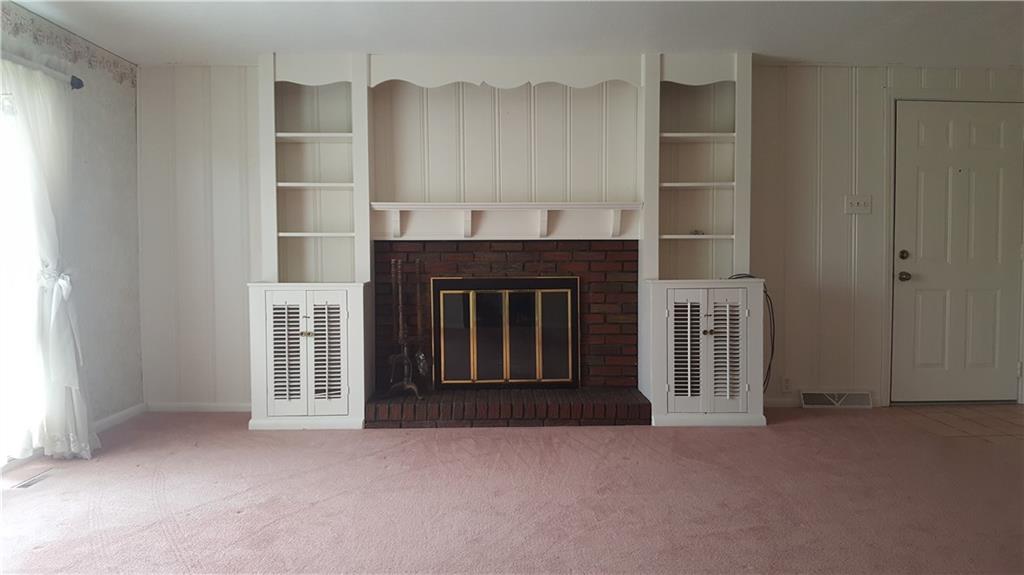 399 Houk Road New Castle, PA 16101 - Photo 8 of 25 Wood burning fireplace in living room